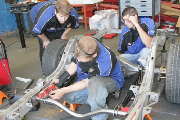 OTC Students work on 57 Chevy Frame